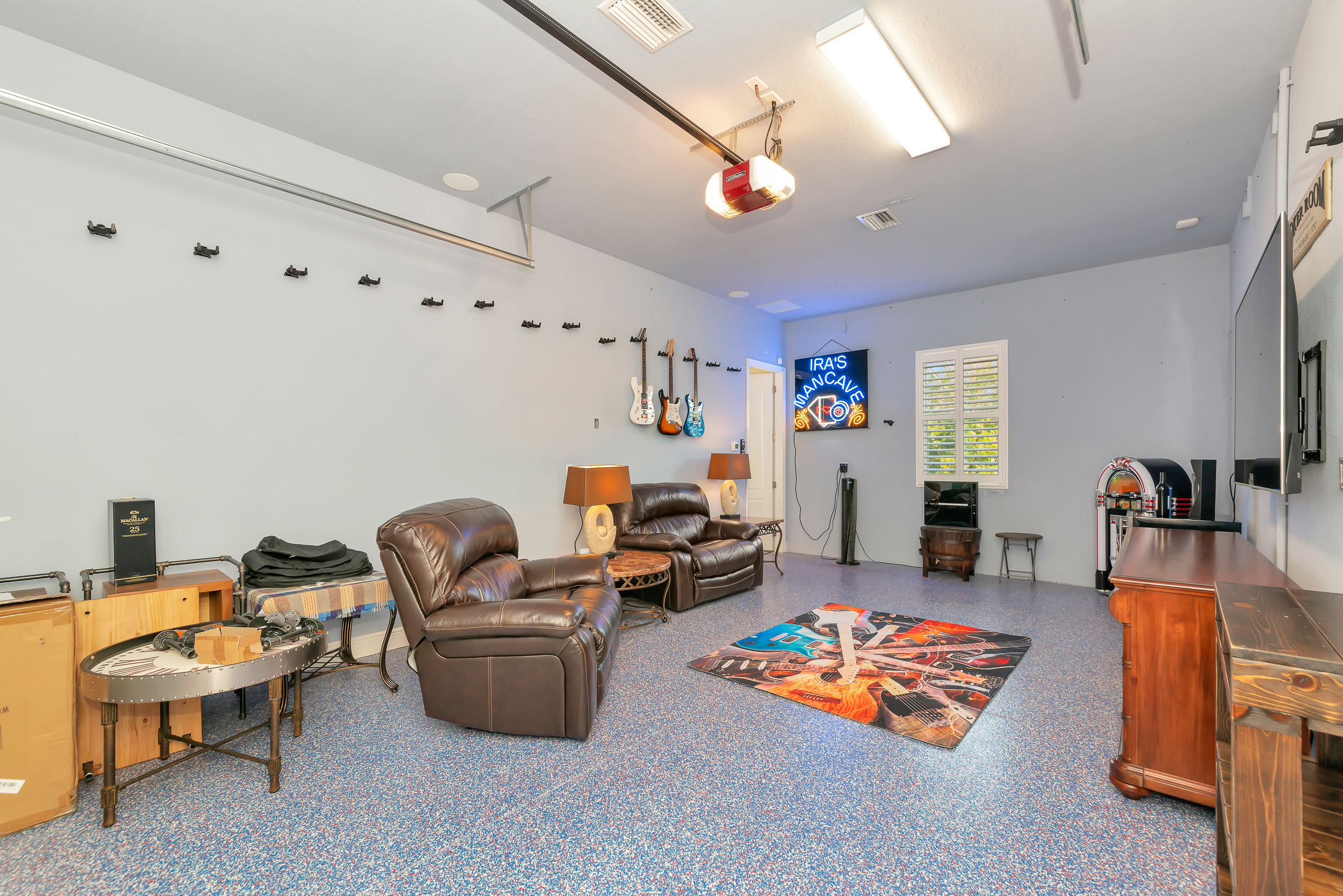 Flex lounge space with recliners, media and an open layout