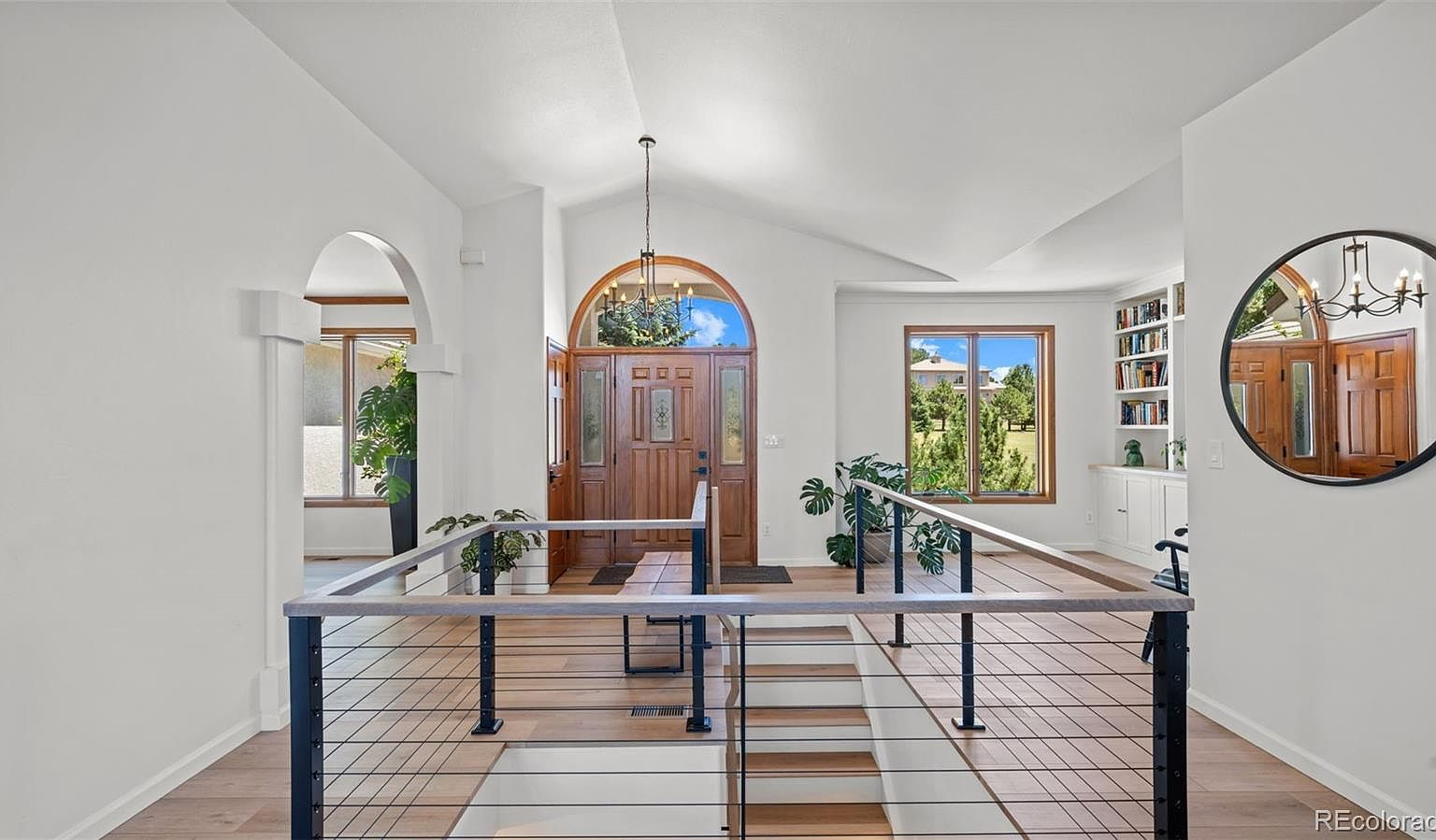Foyer with modern staircase railing