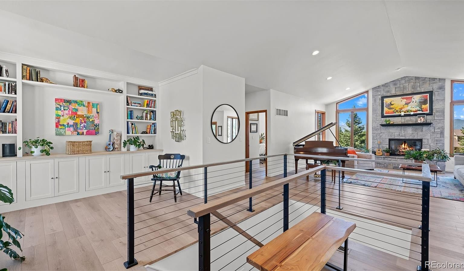 Living room with vaulted ceilings and mountain views