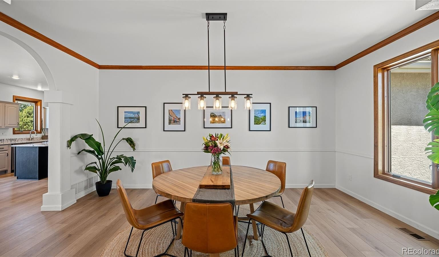 Modern dining area with linear fixture