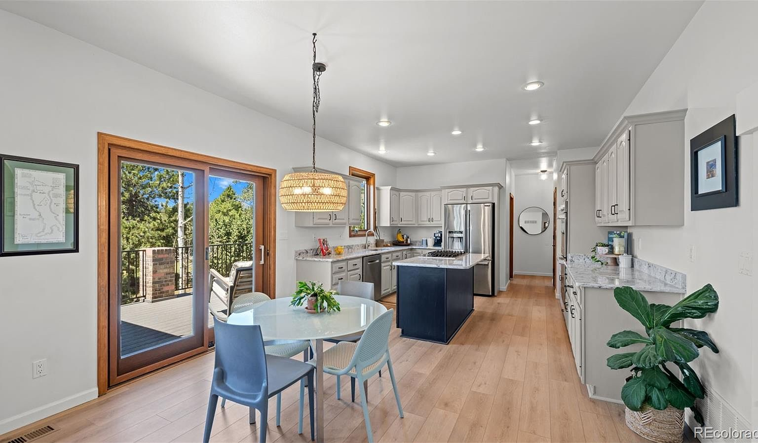 Kitchen and dining area with sliding door to deck