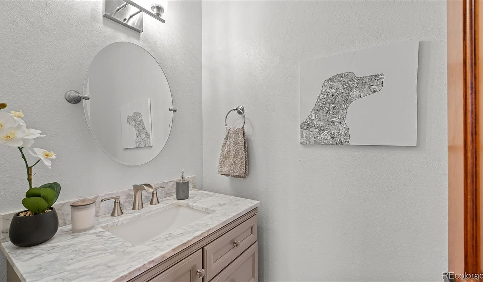 Updated bathroom with marble countertop