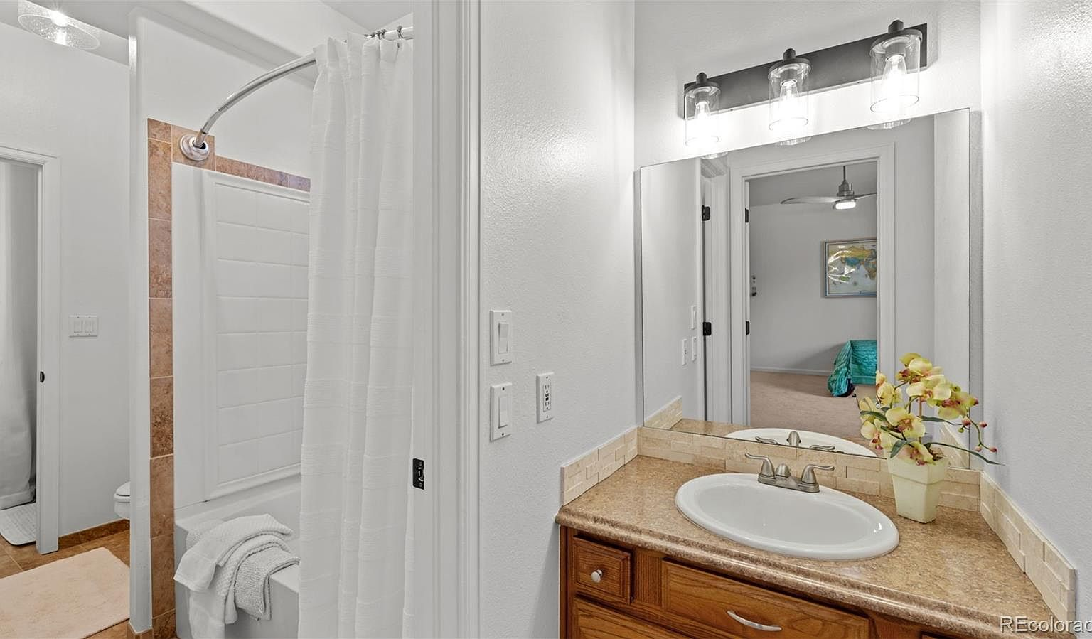Lower-level bathroom with granite vanity