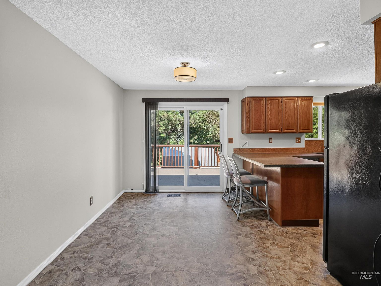 Kitchen and dining area transition with natural daylight