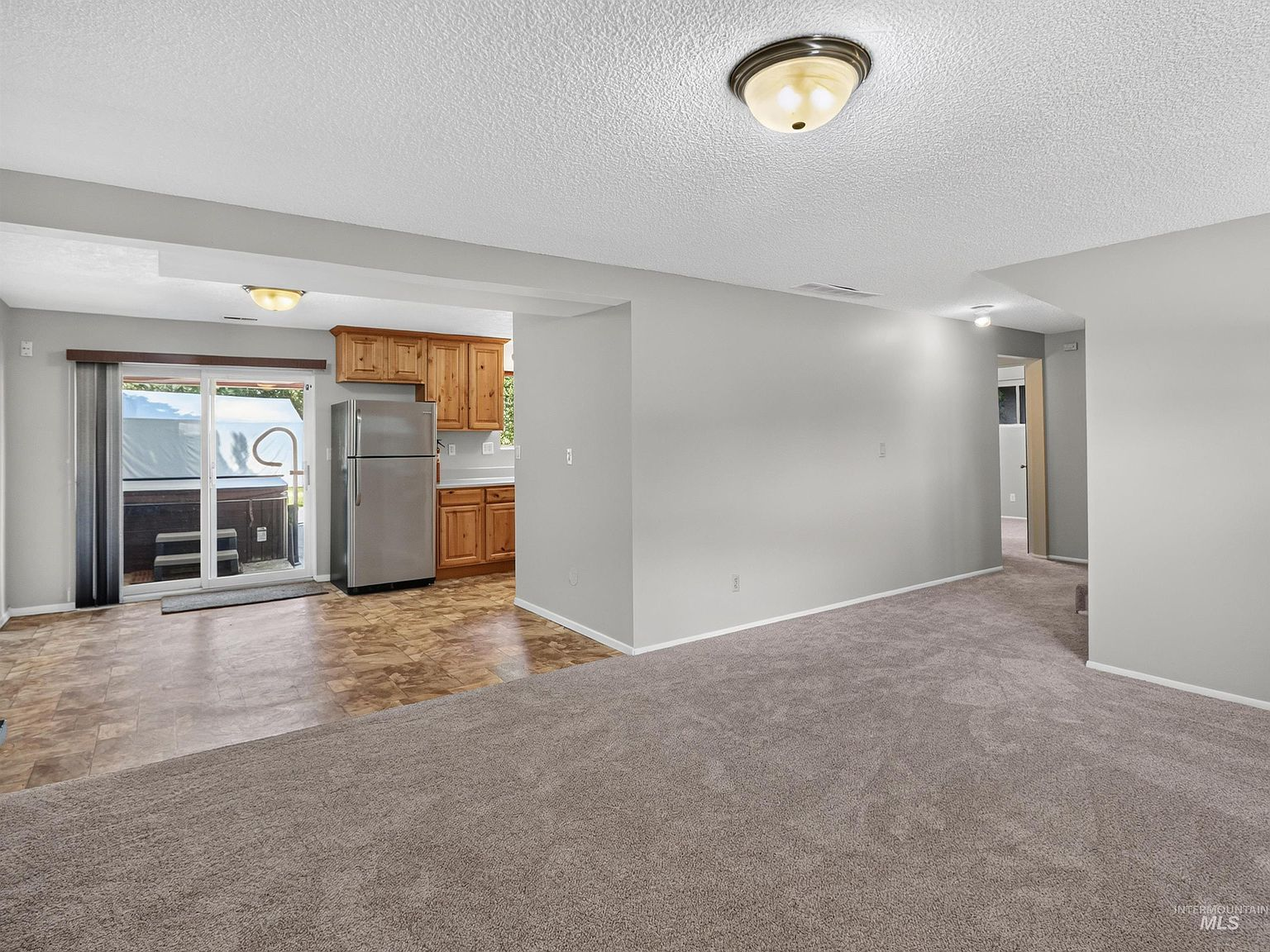 Lower-level living area with kitchen corner
