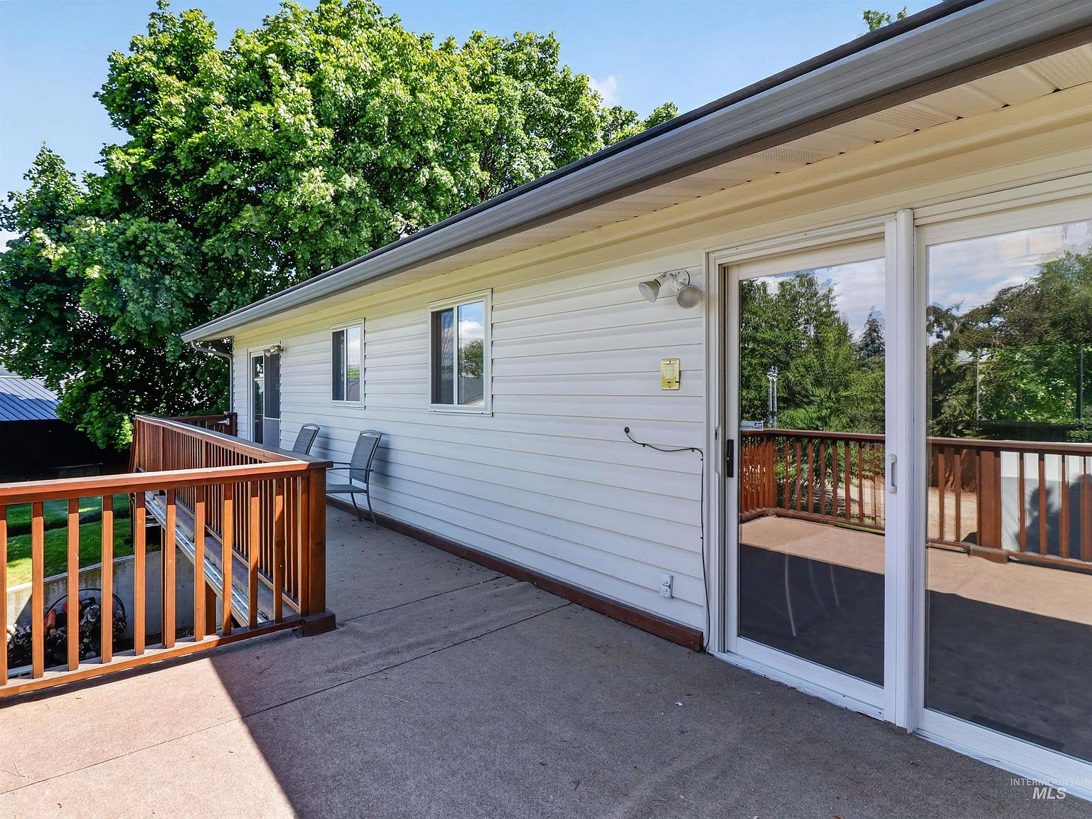 Rear deck overlooking the expansive backyard