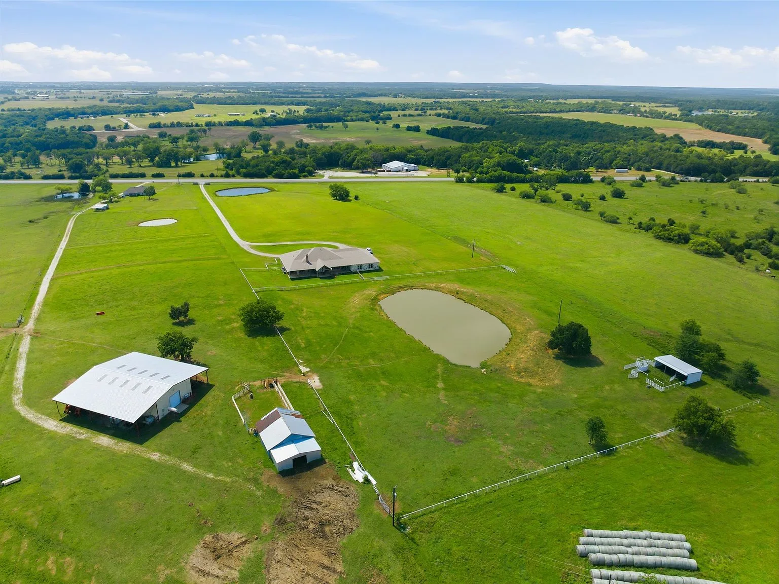 Aerial view of the ranch estate at 28966 US Highway 377, showing the home on its property