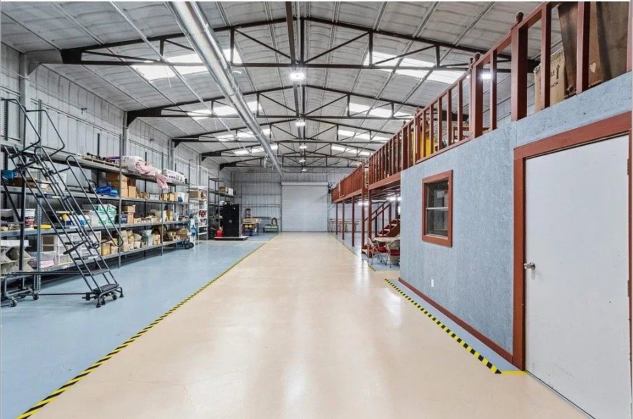 7,900 SF steel shop with mezzanine, finished office, and epoxy floors