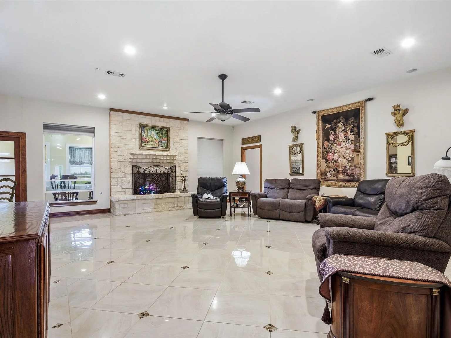 Living room with natural stone fireplace as the focal point