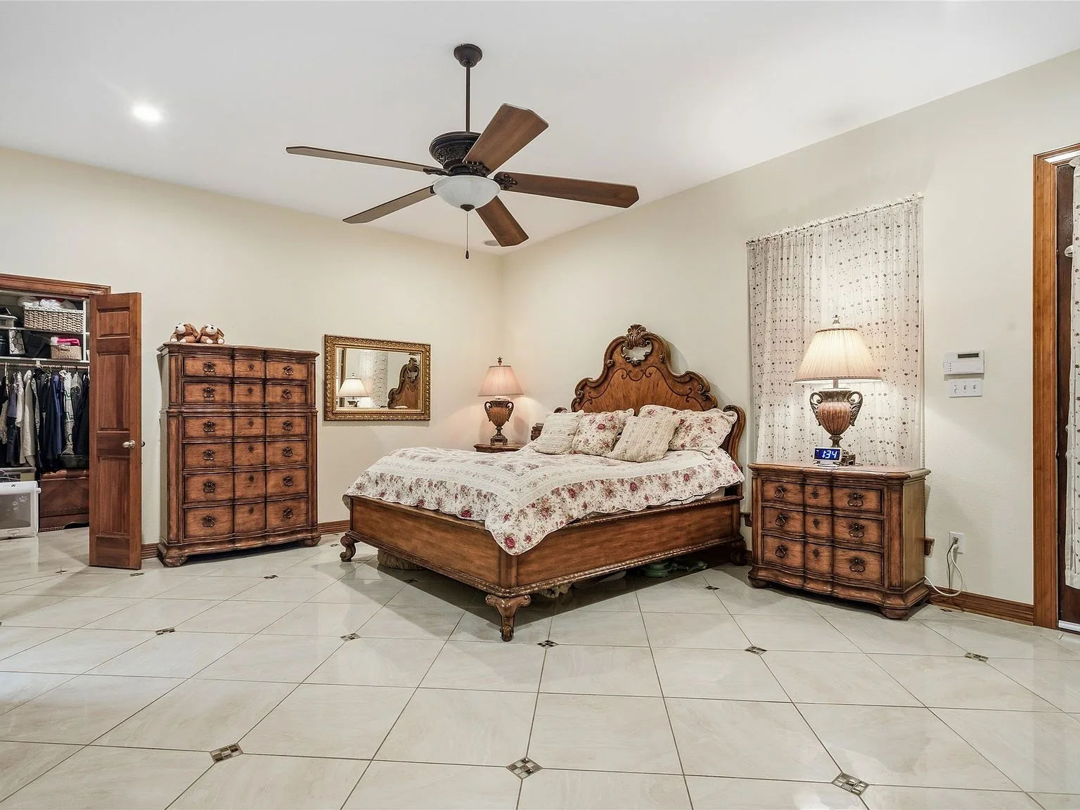 Main owner bedroom suite with ceramic tile and wood trim