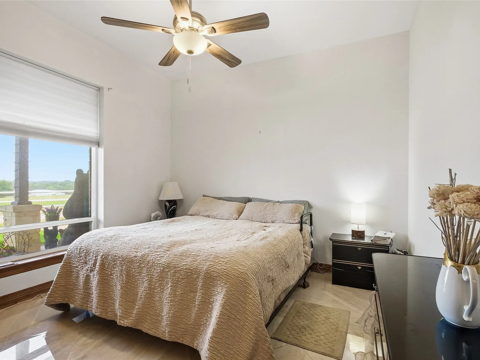 Guest bedroom with pastoral views through large window