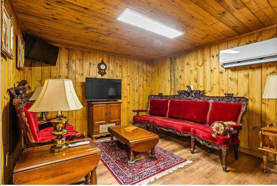 Knotty pine paneled den with rustic cabin feel