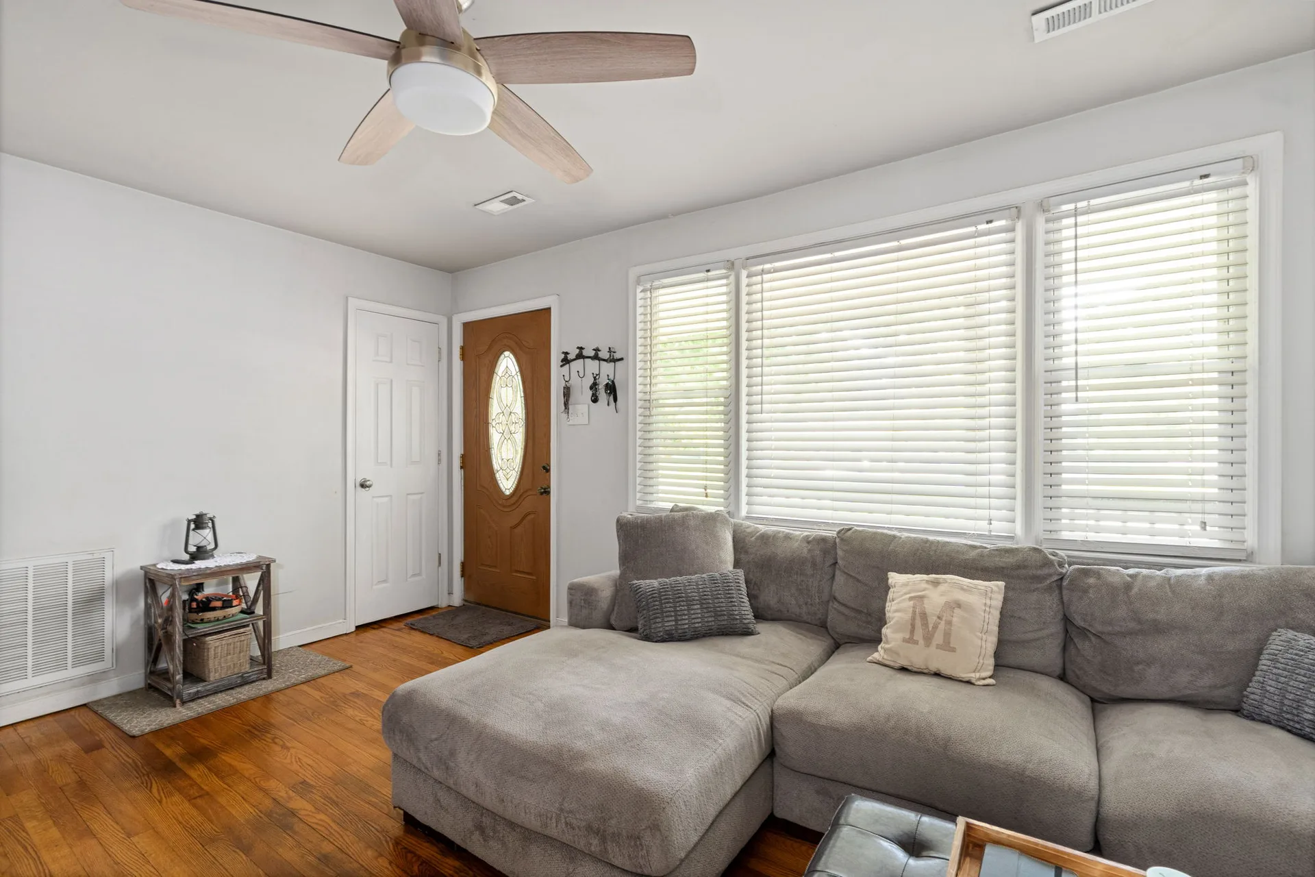 Bright living room with refinished hardwood floors