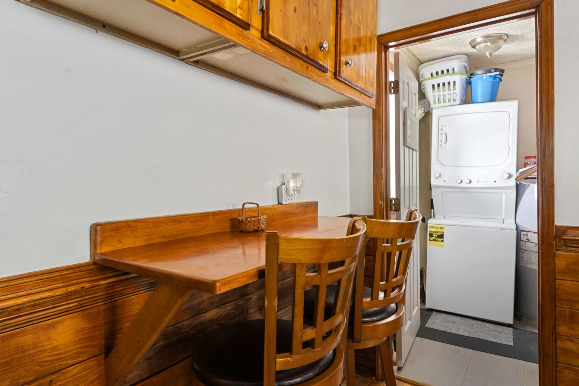 Kitchen nook and desk area leading into the laundry room