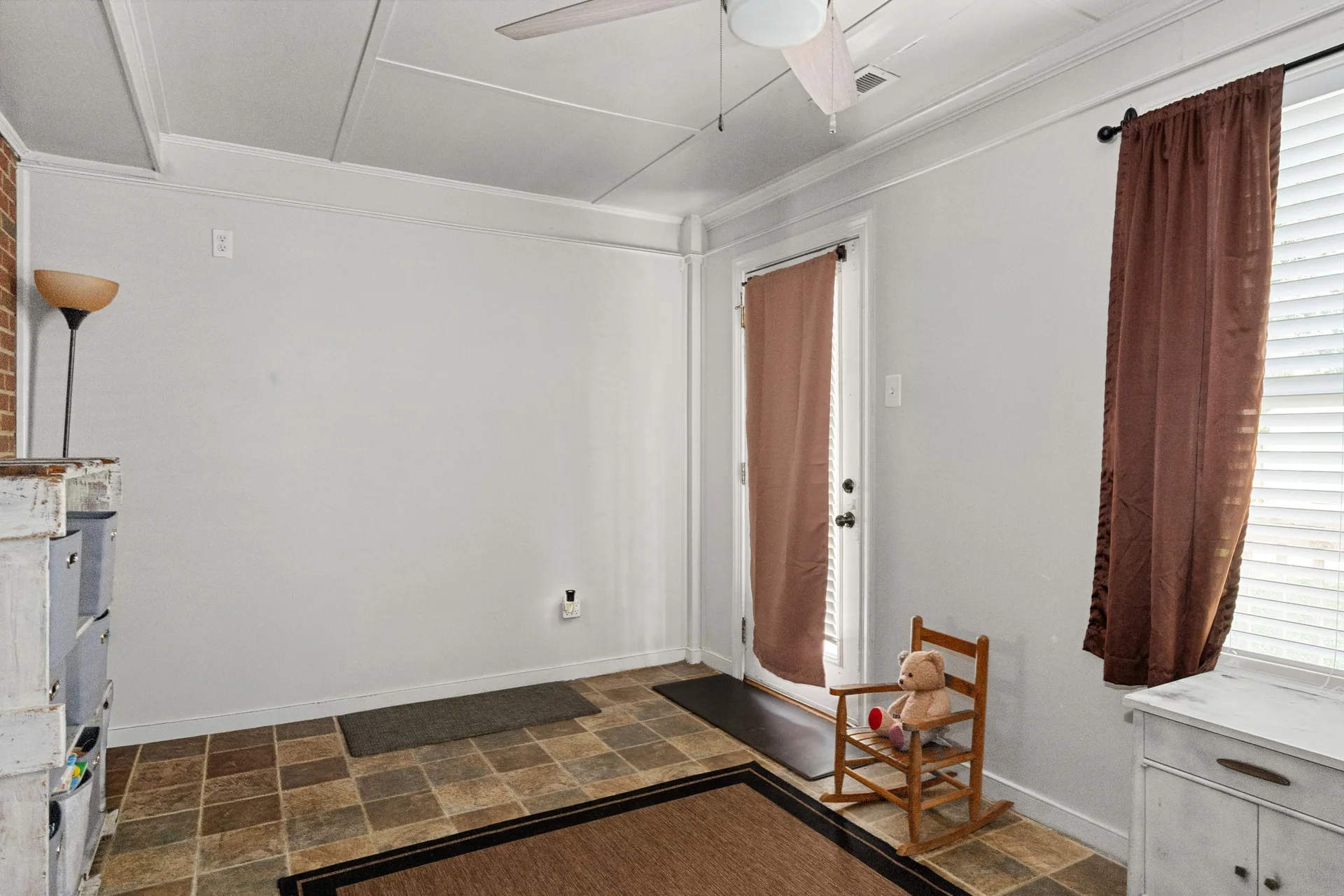 Utility and laundry room with ceramic tile flooring