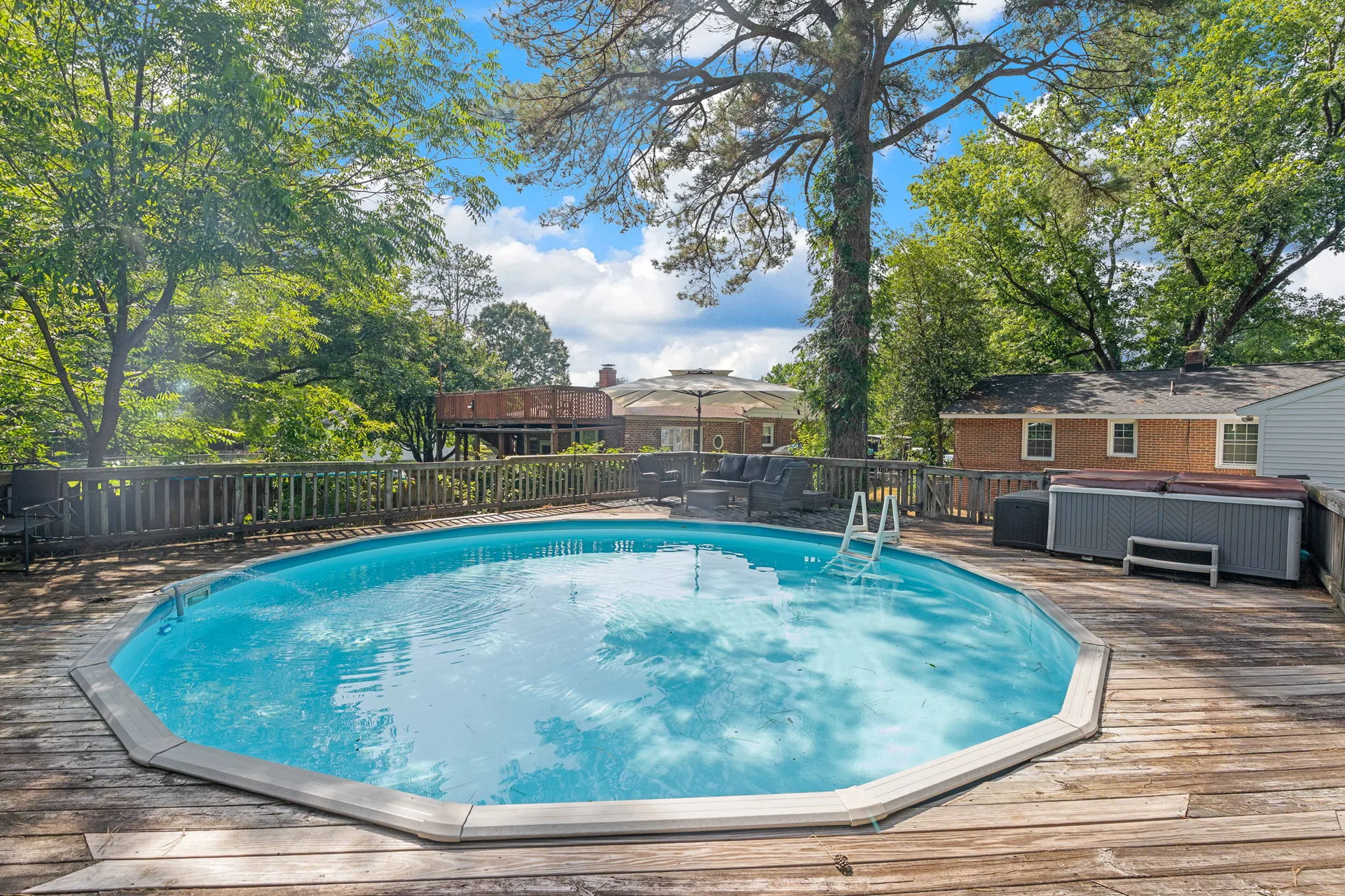 Backyard pool and deck at 1343 Bartlett Rd, perfect for outdoor entertaining