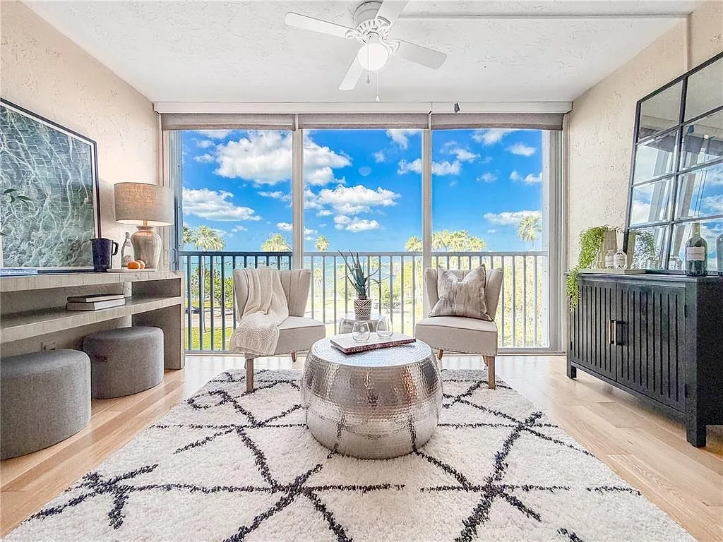 Living room with floor-to-ceiling windows and water views