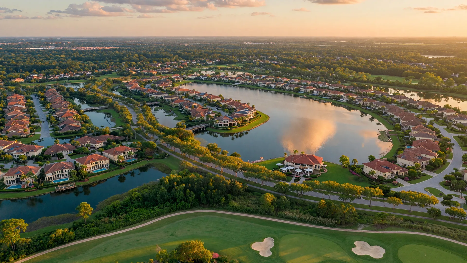 Aerial view of Lakewood Ranch, Florida at golden hour — a master-planned community with lakes, golf courses, and Mediterranean-style homes