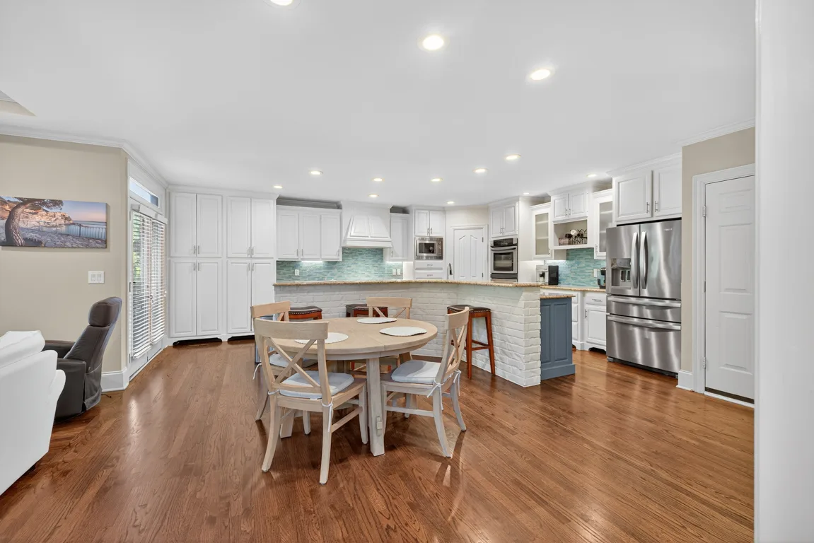 Kitchen with breakfast nook and sliding door to deck