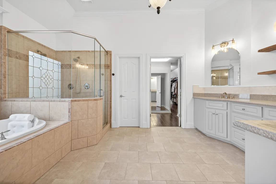 Primary bathroom with walk-in shower and soaking tub