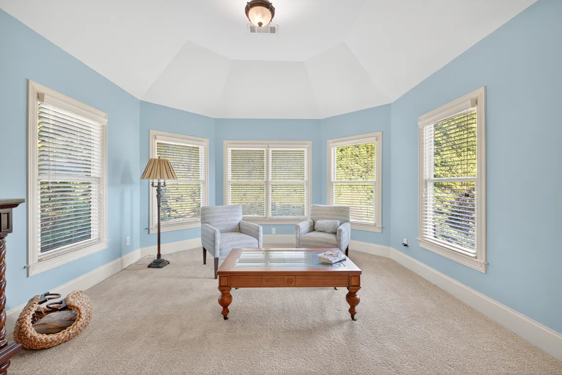 Sitting room with bay window and light blue walls