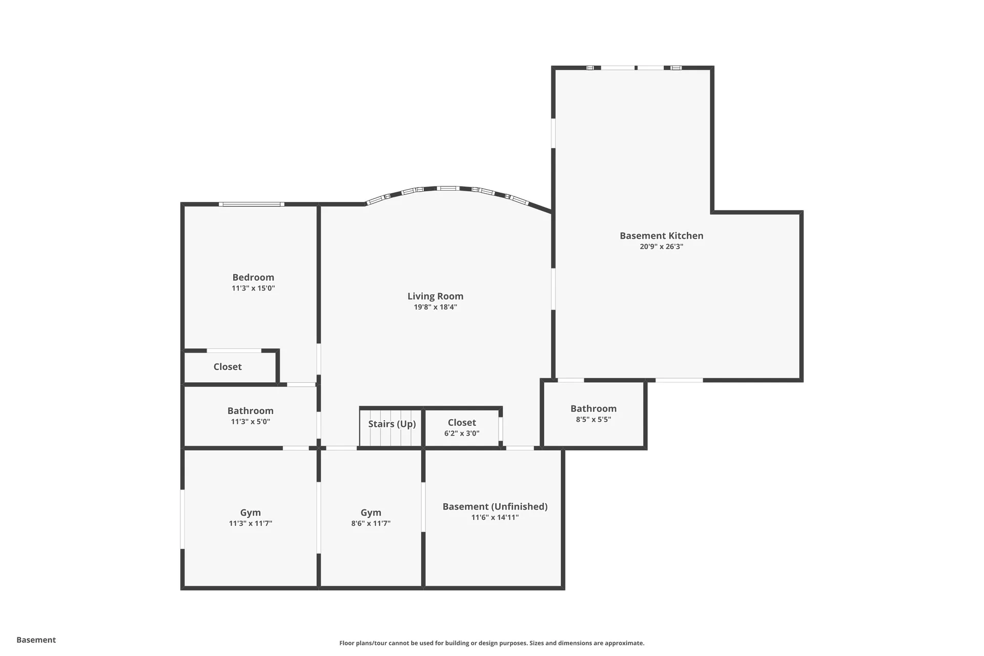 Basement floor plan showing bedroom, gym spaces, living room, kitchen, and bathrooms