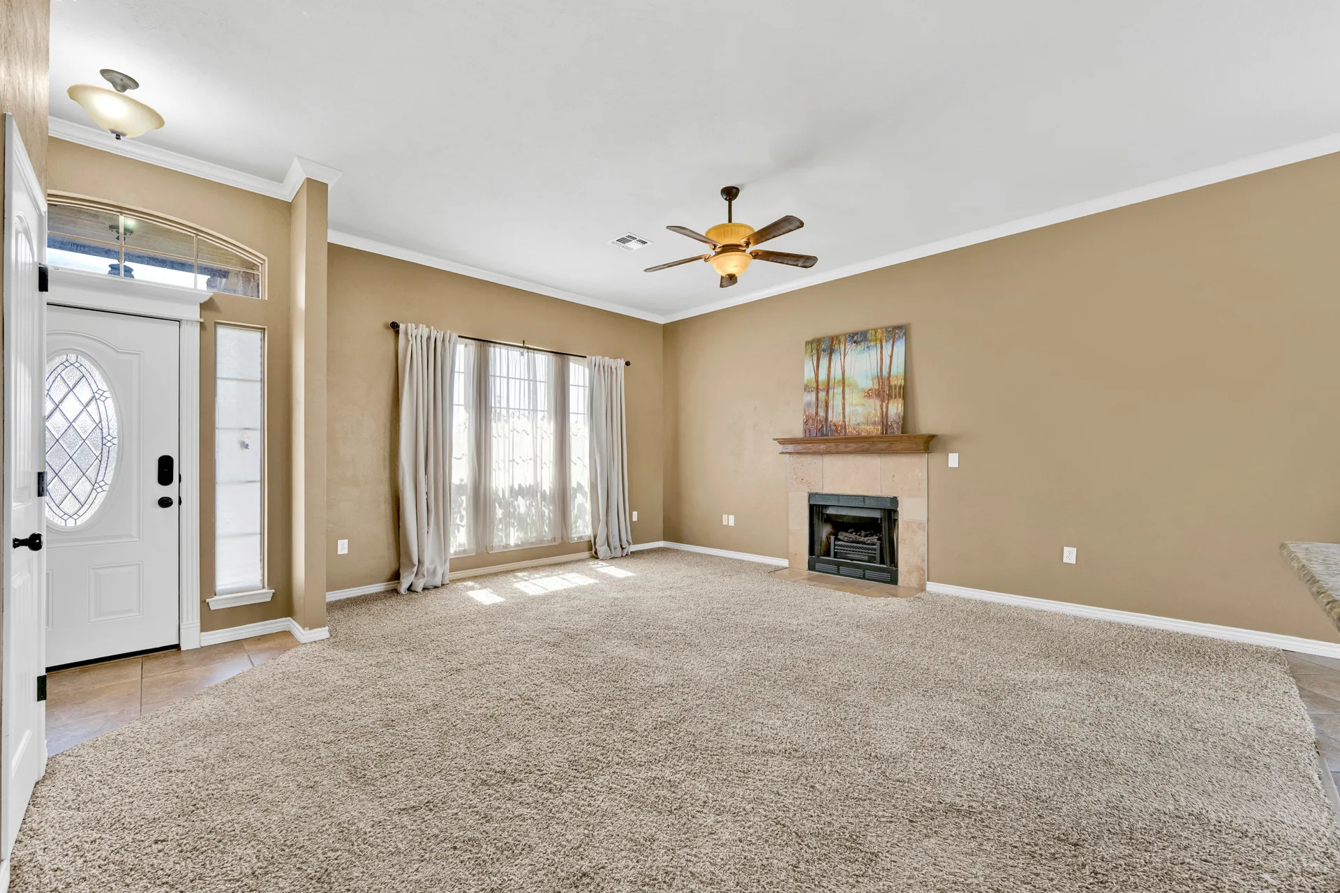 Living room from entryway perspective with natural light