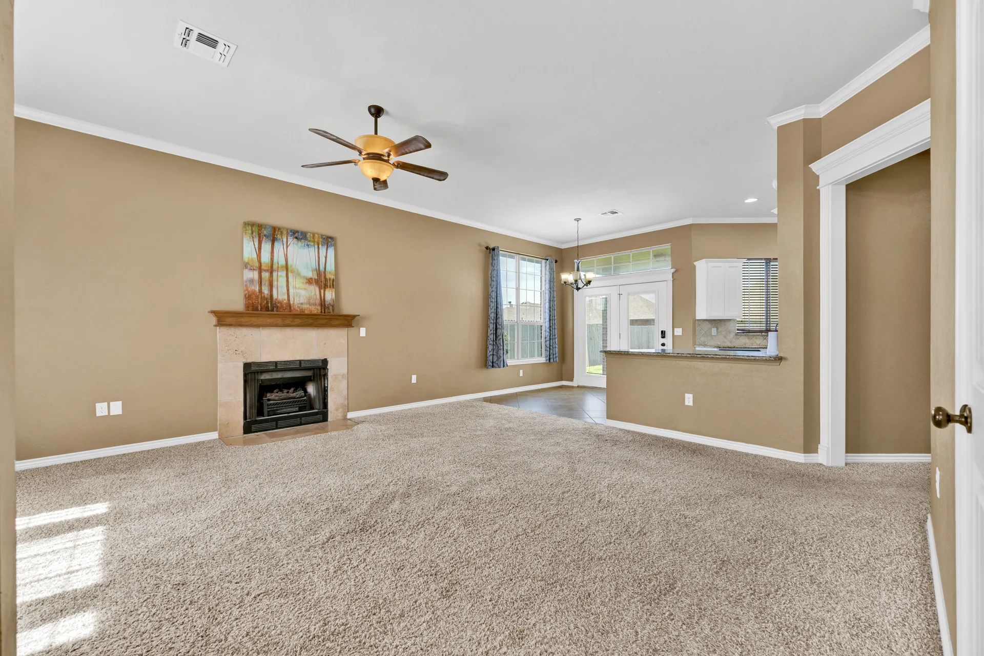Open living and dining area with sliding glass doors