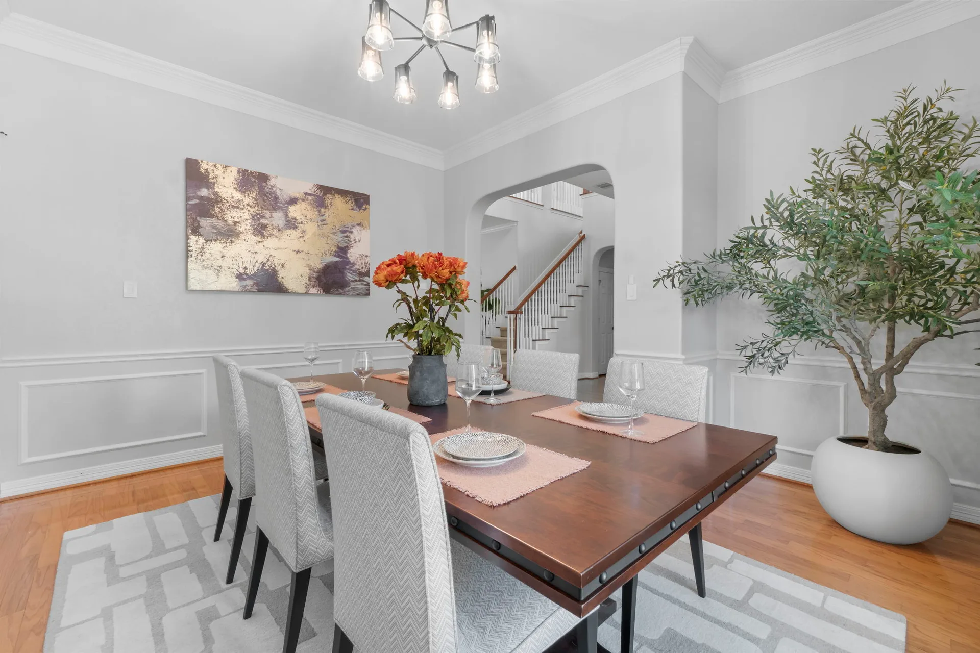 Formal dining room with wainscoting and chandelier
