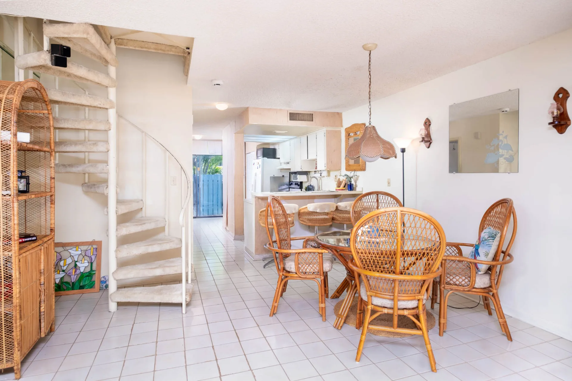 Living and dining area showing spiral staircase detail