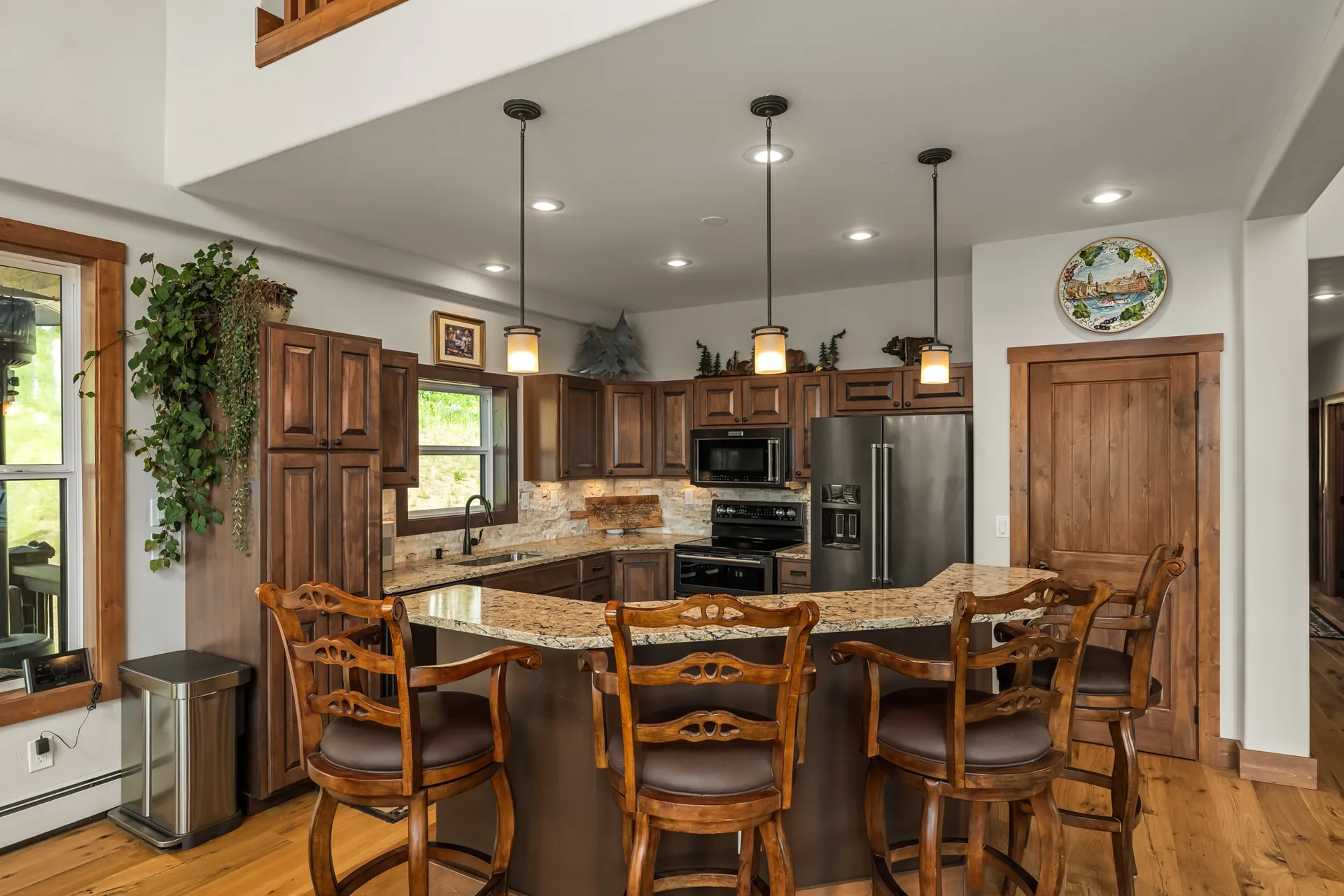 Rustic kitchen with bar seating and knotty wood cabinetry