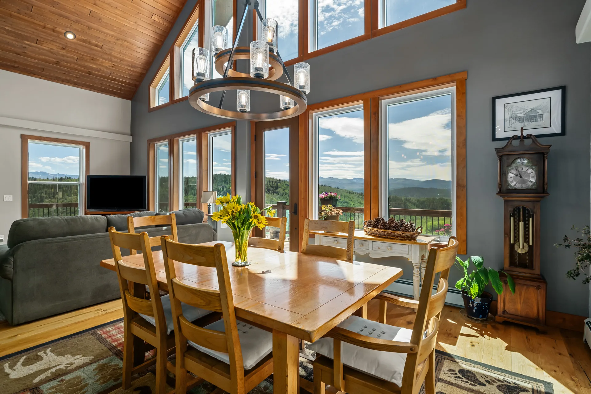 Open concept dining area with wood ceilings and expansive views