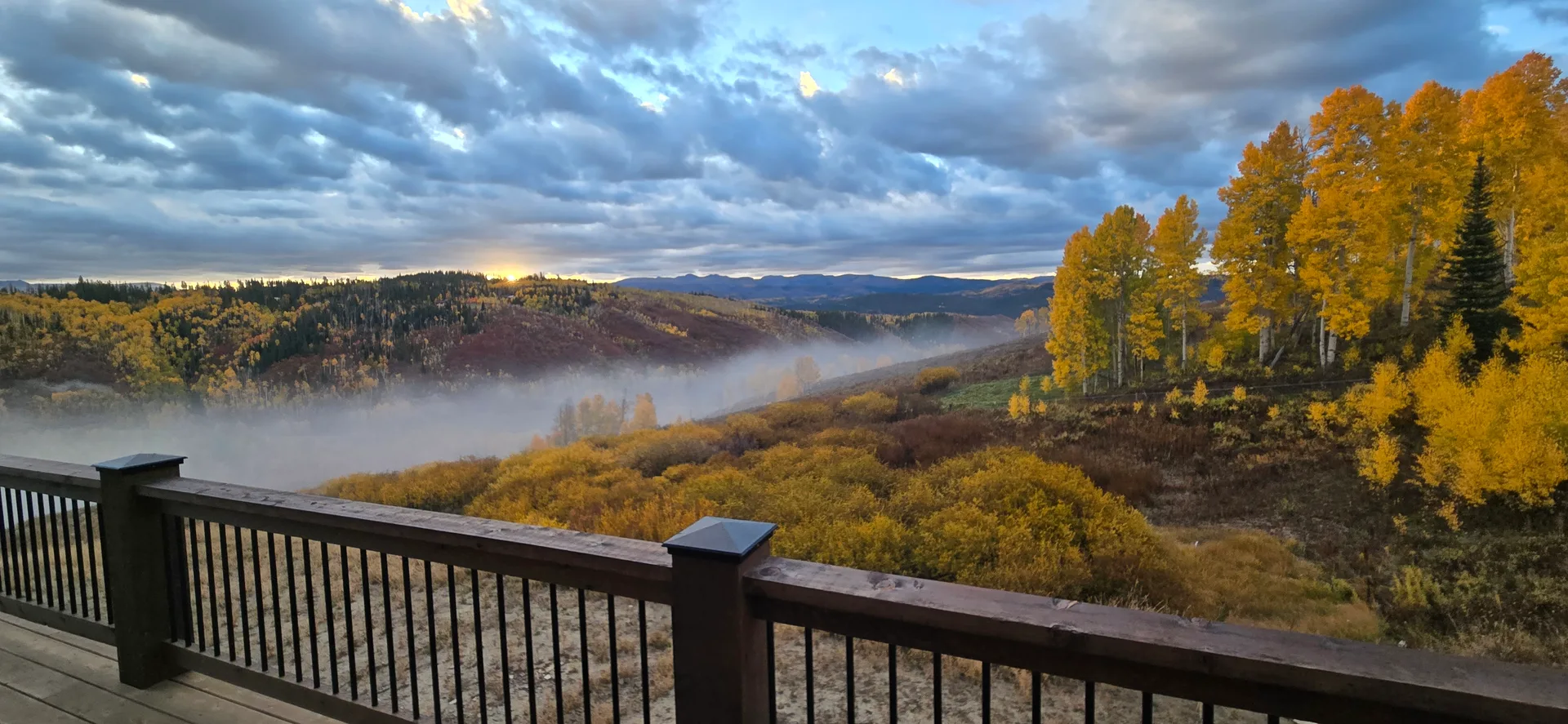 Expansive mountain views from the deck at 57140 Green Bird Place