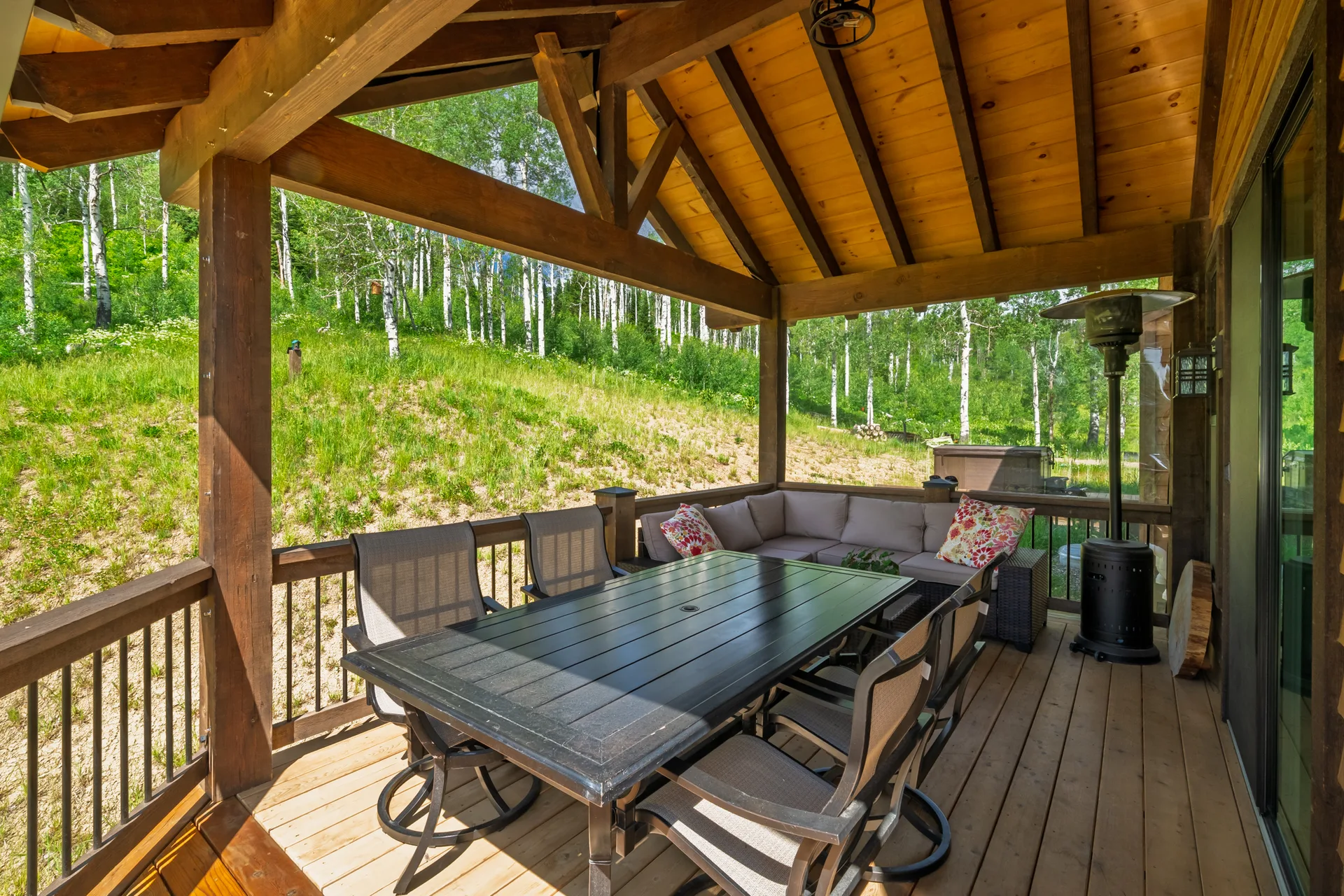 Covered outdoor patio with mountain views