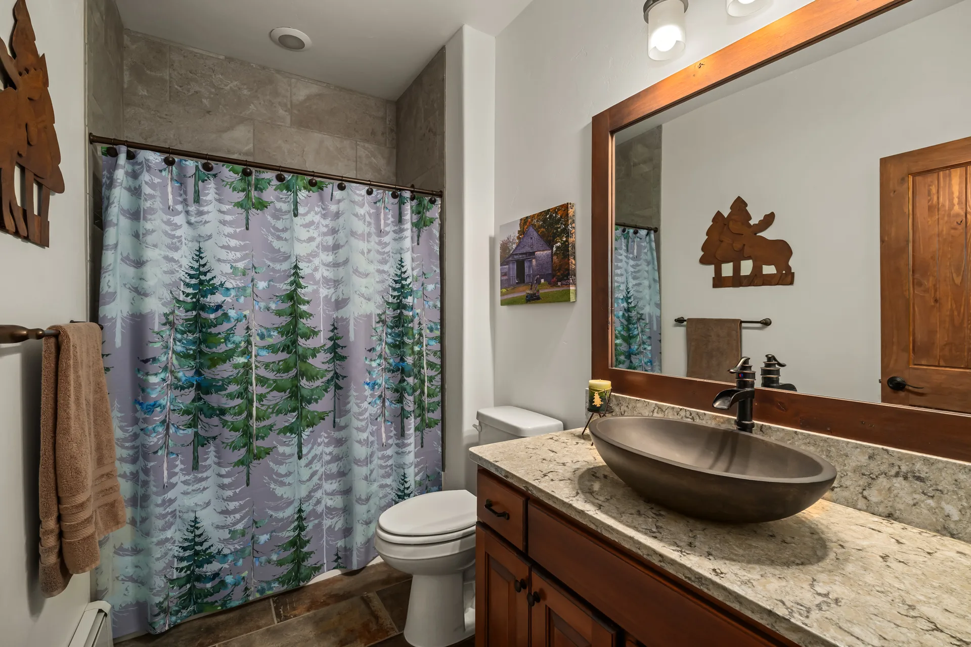 Rustic mountain bathroom with quartz countertop and vessel sink
