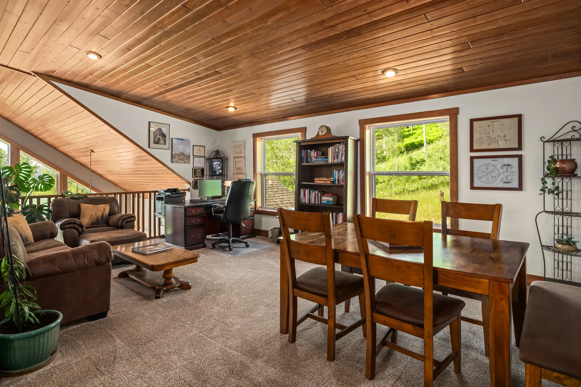 Loft multipurpose space with office and dining areas