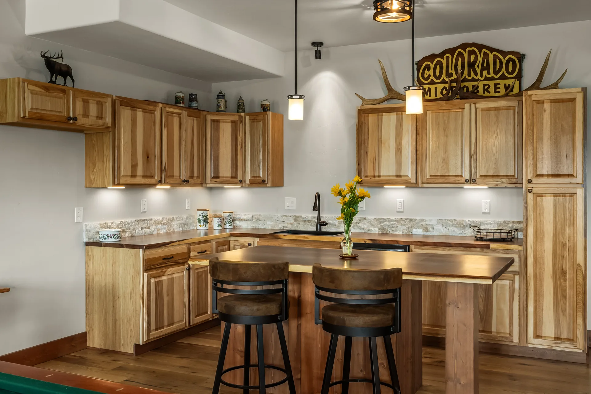 Rustic kitchen wet bar with live-edge countertops