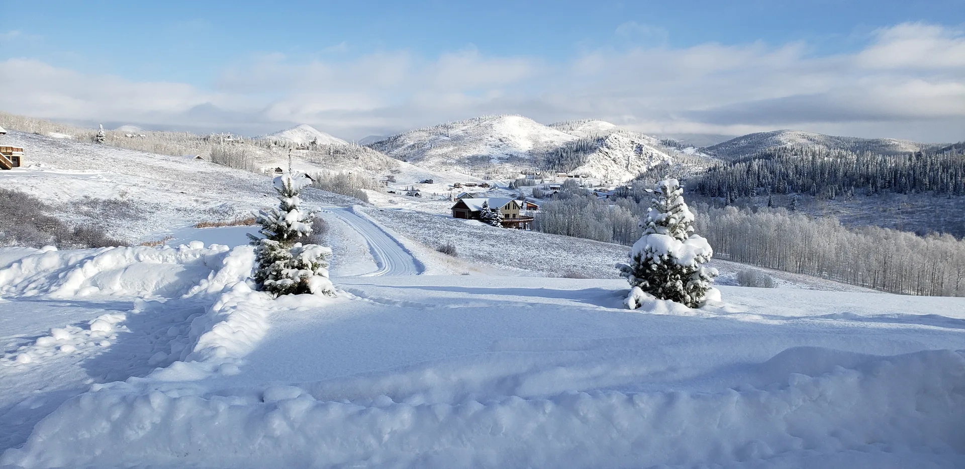 Panoramic winter mountain views with heavy snow cover