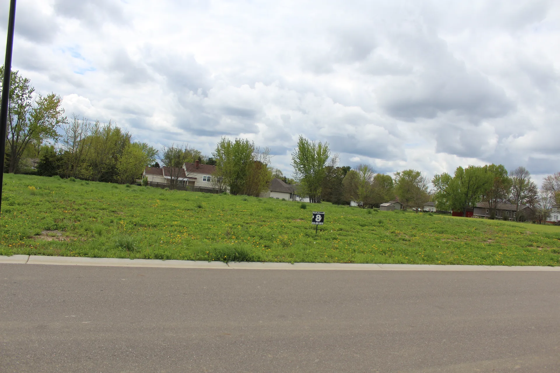 Vacant residential lot at 5407 Spring Meadows Way in Linden, Michigan