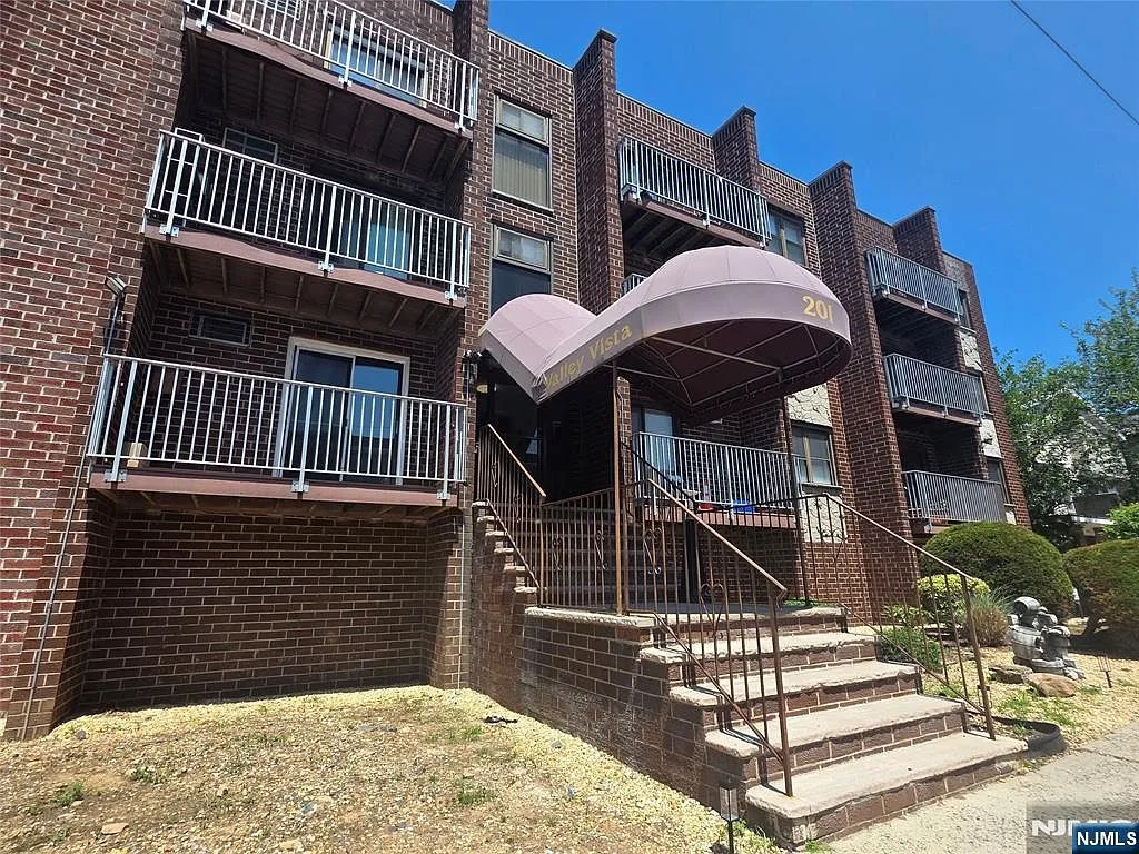 Exterior of 201 12th St, a mid-rise condominium building in Palisades Park, NJ
