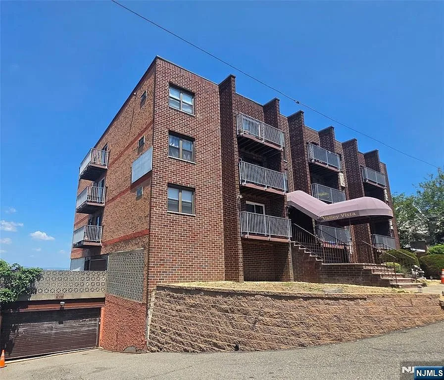 Exterior perspective of the mid-rise condominium building