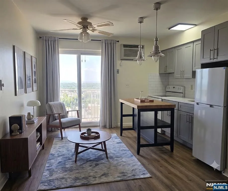 Open-concept kitchen and living area with new sliding glass doors