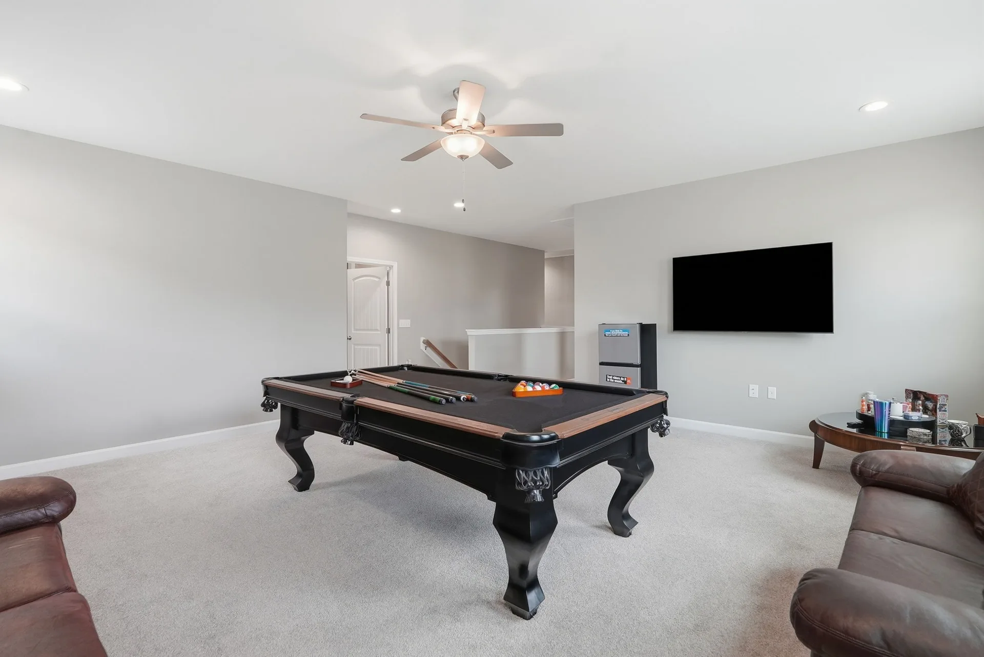 Loft bonus room with recessed ceiling lighting, neutral walls, and beige carpeting