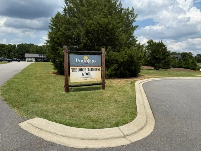 The Lodge Clubhouse and Pool signage at the Portofino community entrance