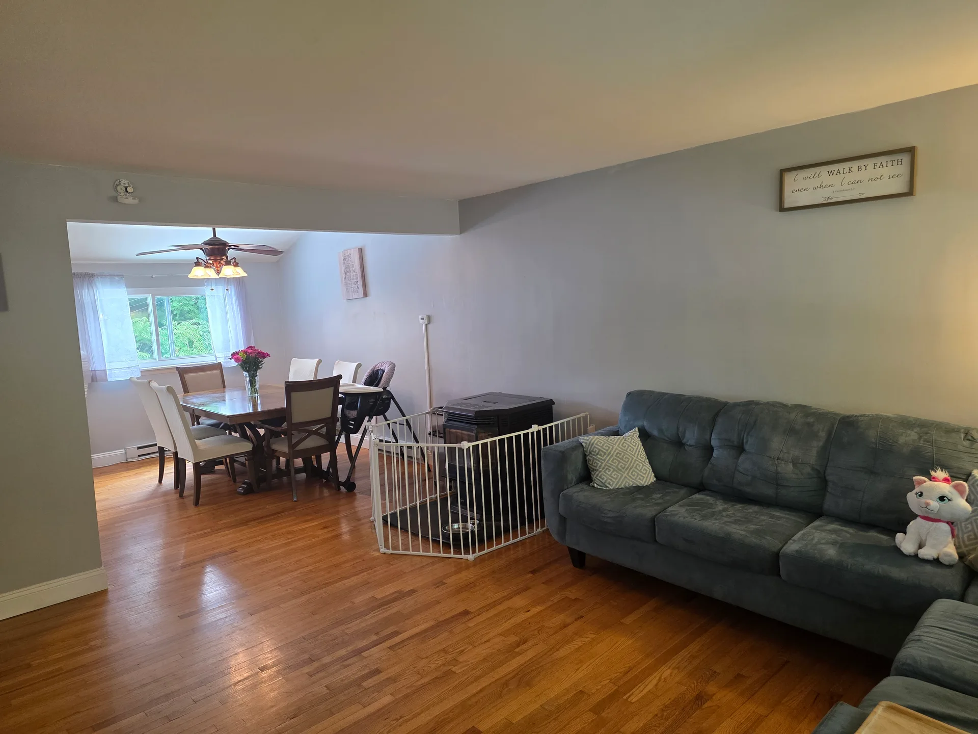 Open-concept living and dining area with hardwood floors at 3650 Stephen Crane Ln
