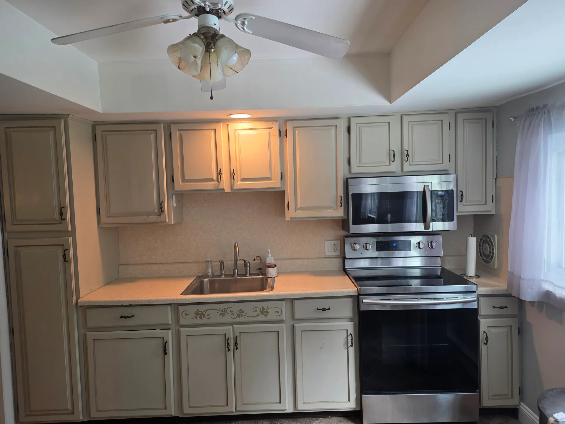 Kitchen cabinetry and stainless steel range