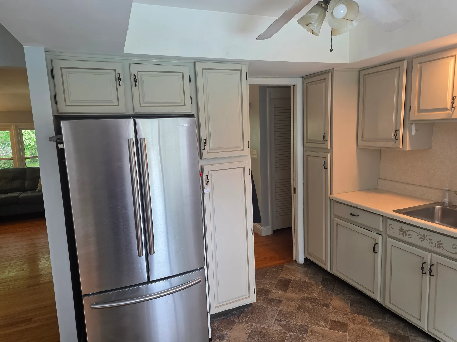 Kitchen cabinetry and stainless steel refrigerator