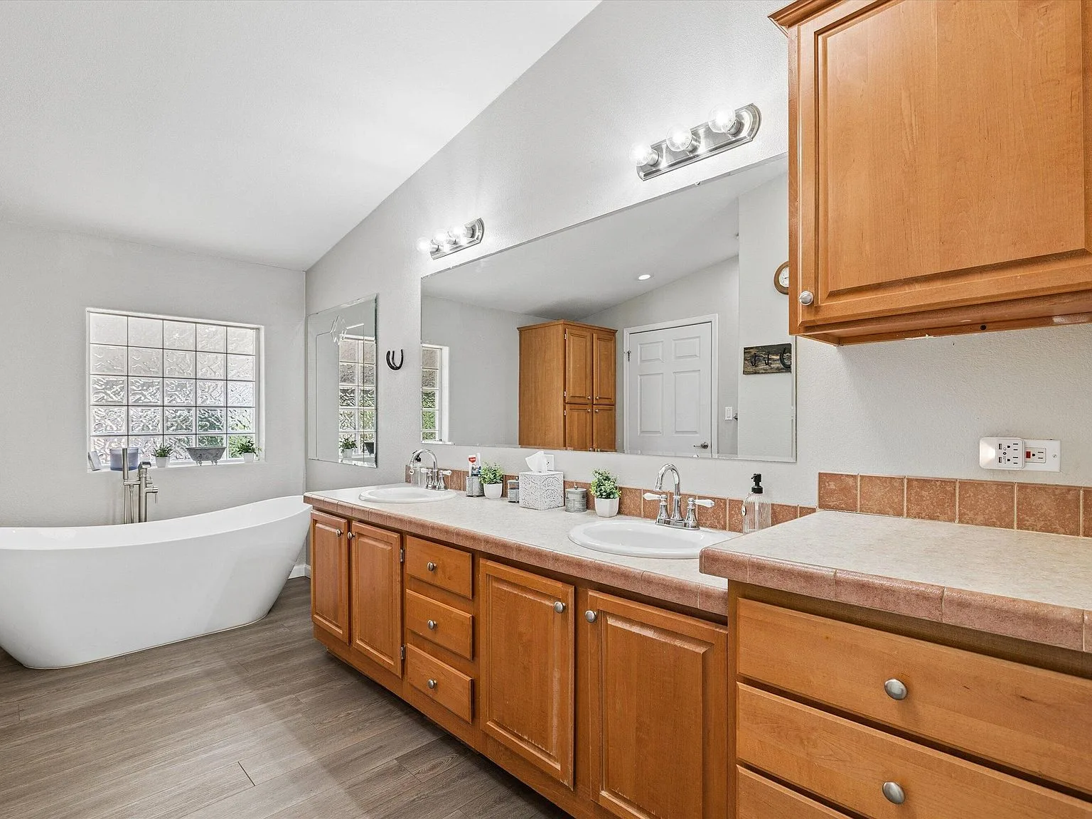 Master bathroom with soaking tub and vanity