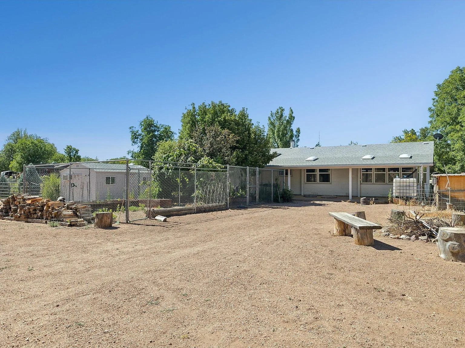 Backyard view showing rear of house and grounds