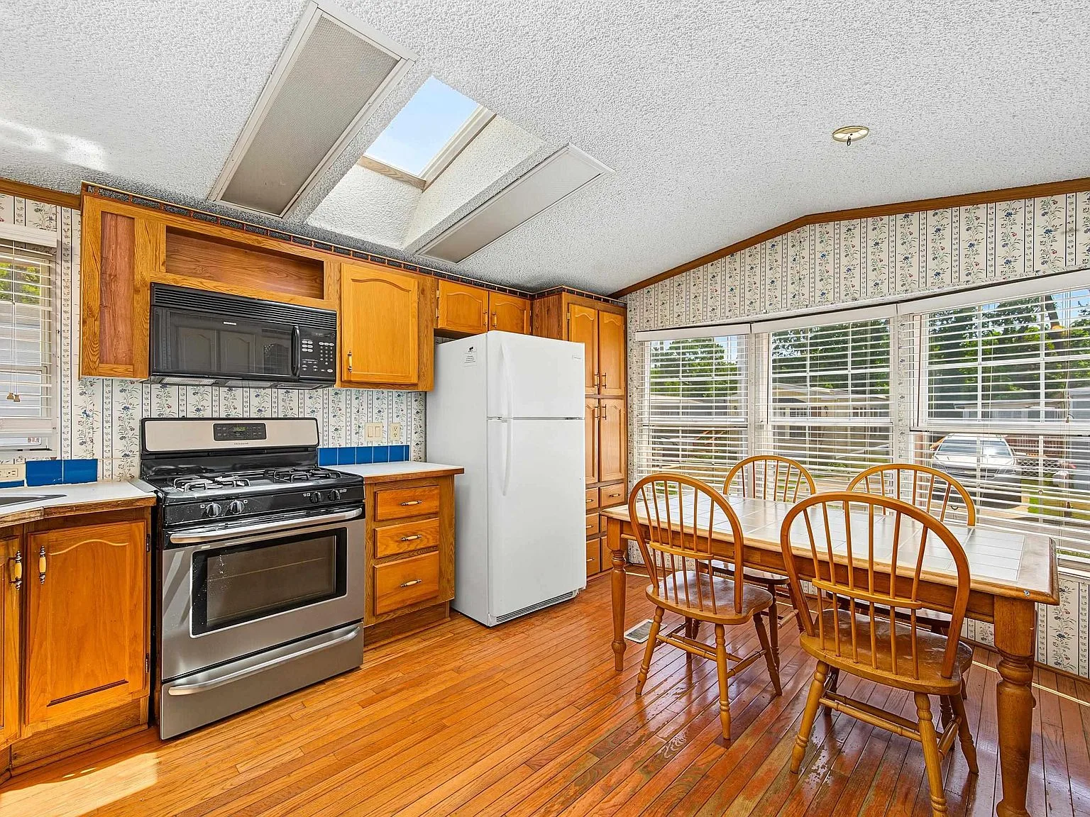 Eat-in kitchen with breakfast nook and skylight